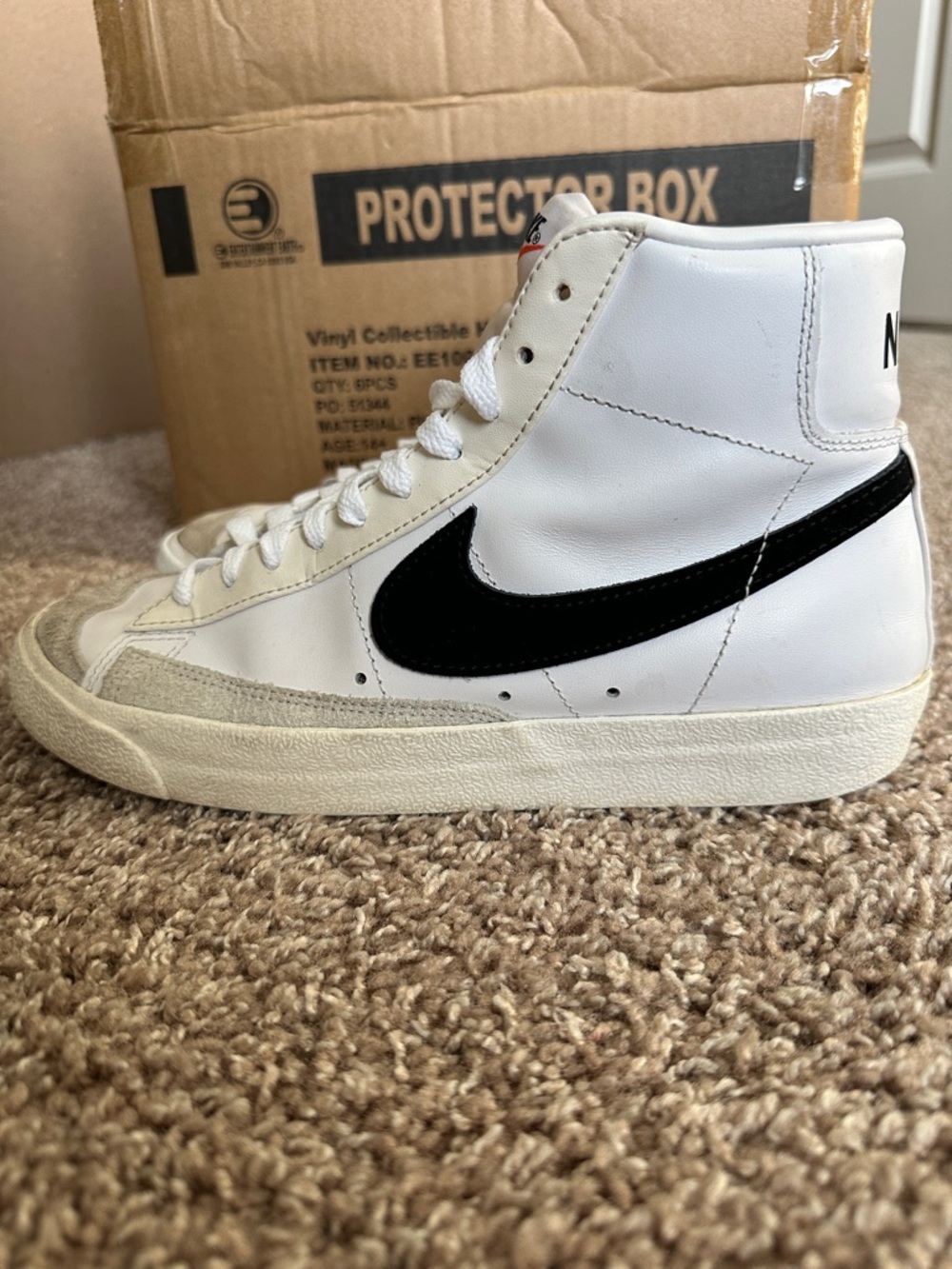 Nike High-Top White Sneakers with Black Swoosh